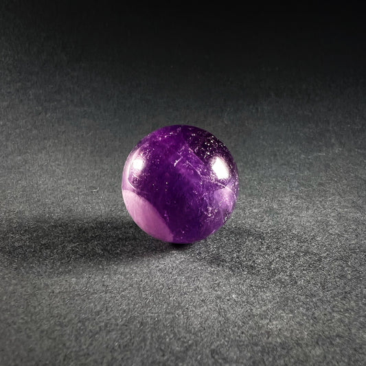 Beautiful purple crystal sphere made of amethyst.