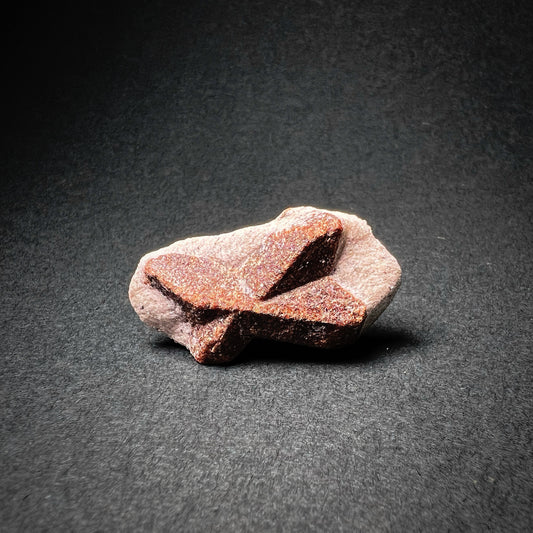 Staurolite stone with bow tie shape
