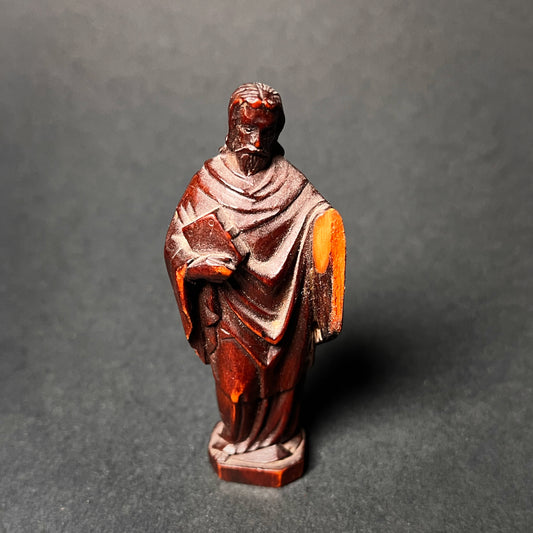 Wooden statue of a christian apostle. Front view.