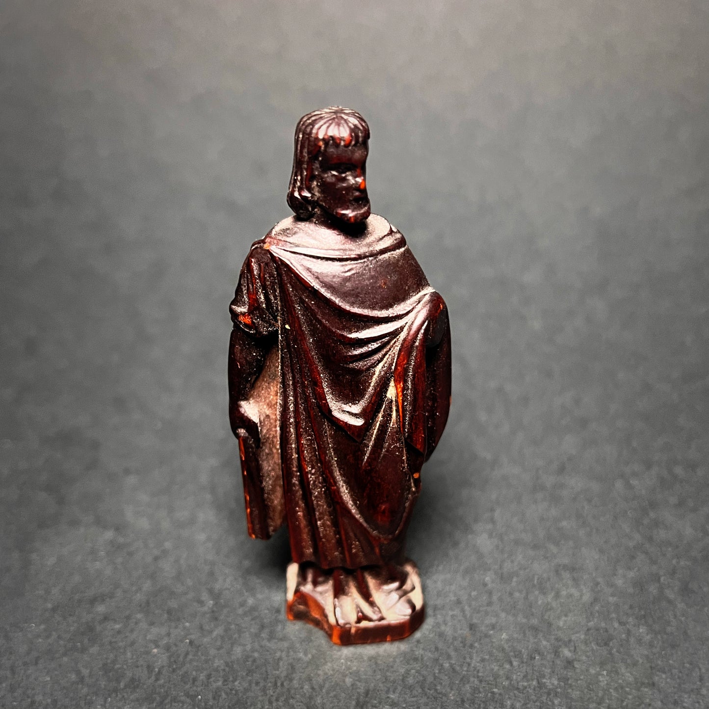Wooden statue of a christian apostle. Front view.