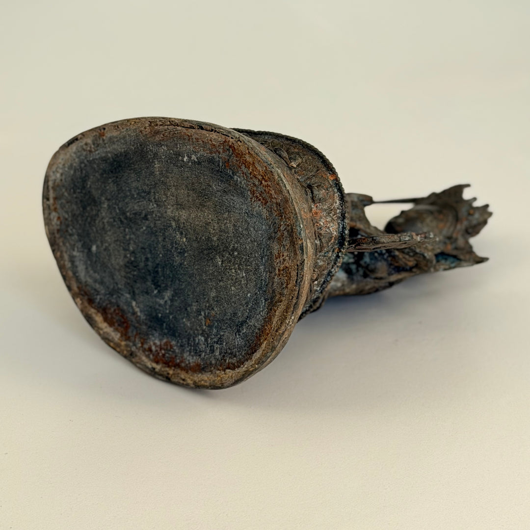 Underside of bronze statue showing hollow base