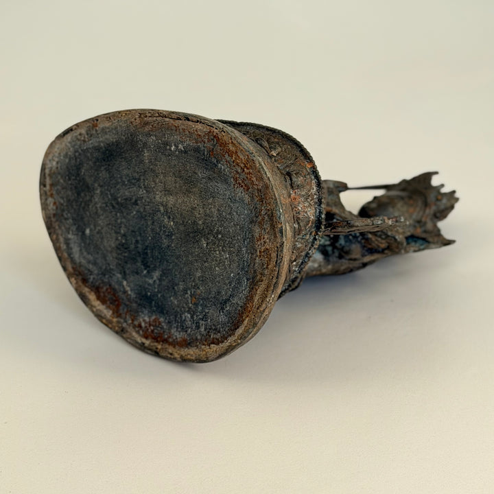 Underside of bronze statue showing hollow base