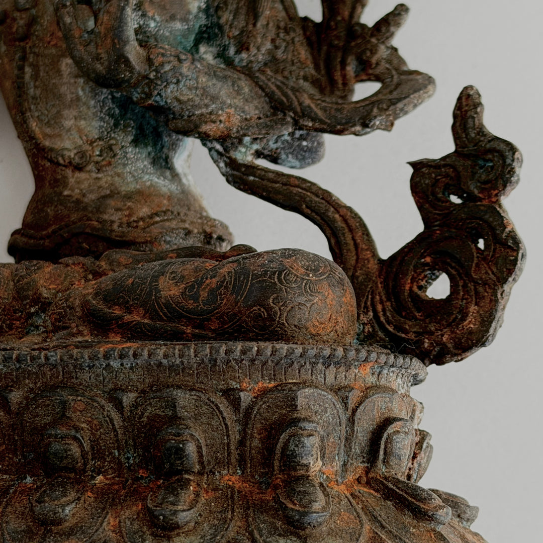 Torso detail with ornamentation and patina