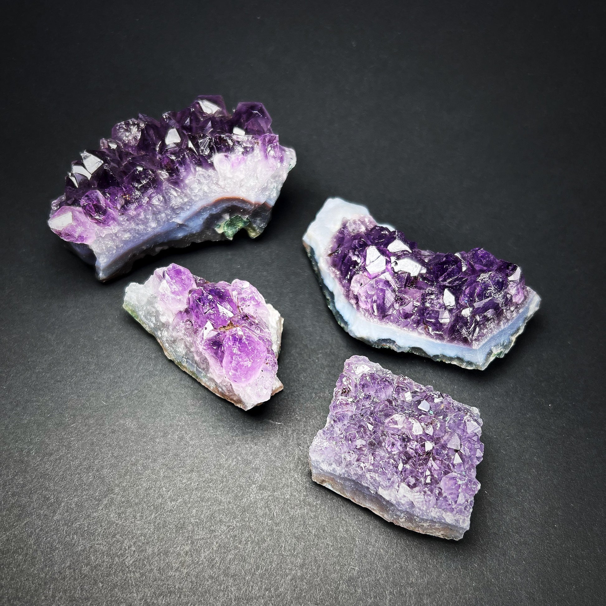 Amethyst set of four geode pieces.