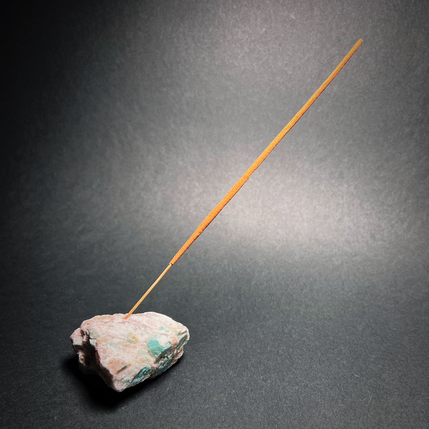 Incense stick stand from raw Amazonite.