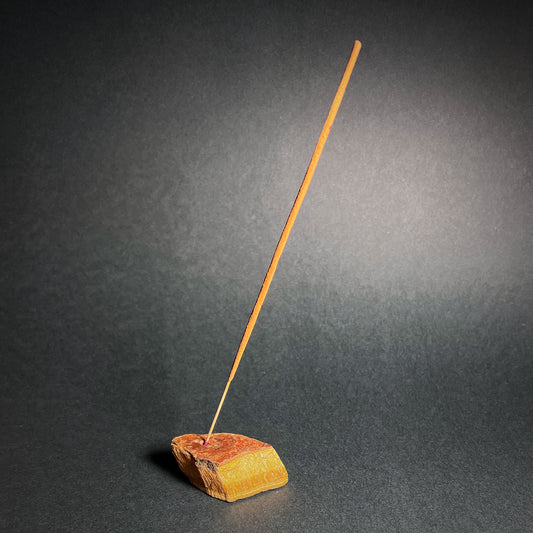 Incense stick stand from raw Tiger eye.