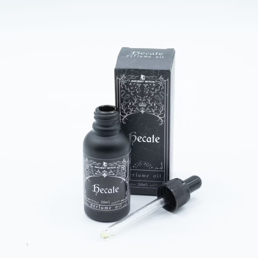 Avattu Hecate-parfyymiöljypullo, lasipipetti ja pakkaus. / Open Hecate perfume oil bottle with glass dropper and box.