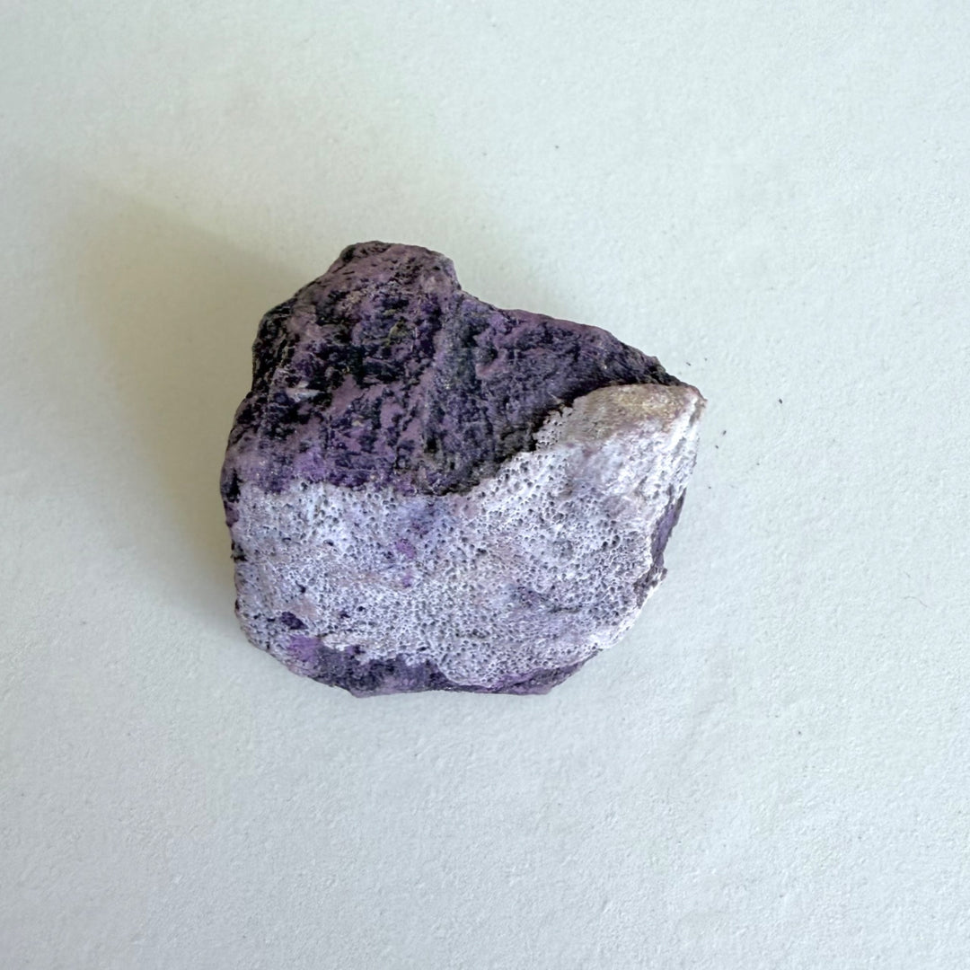 Purpurite Stone 2, a small, thick violet rough mineral.