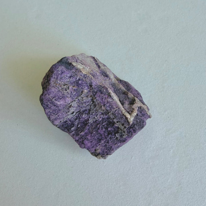 Close-up of Purpurite Stone 2 showing its natural purple surface.