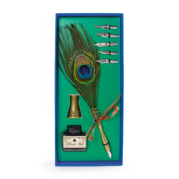 Peacock feather quill pen, pen stand, five spare nibs and a bottle of ink in a blue gift box with a green lining.
