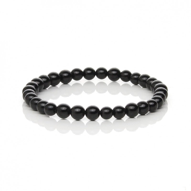 Black tourmaline bracelet with polished round beads measuring approximately 6 mm on a white background.