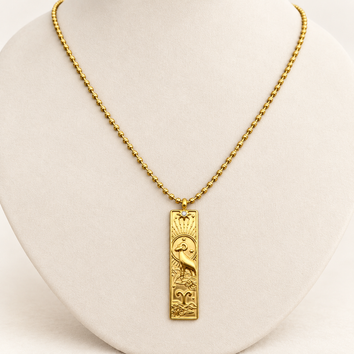18K gold-plated Zodiac necklace, Aries, on a light-coloured jewellery bust.