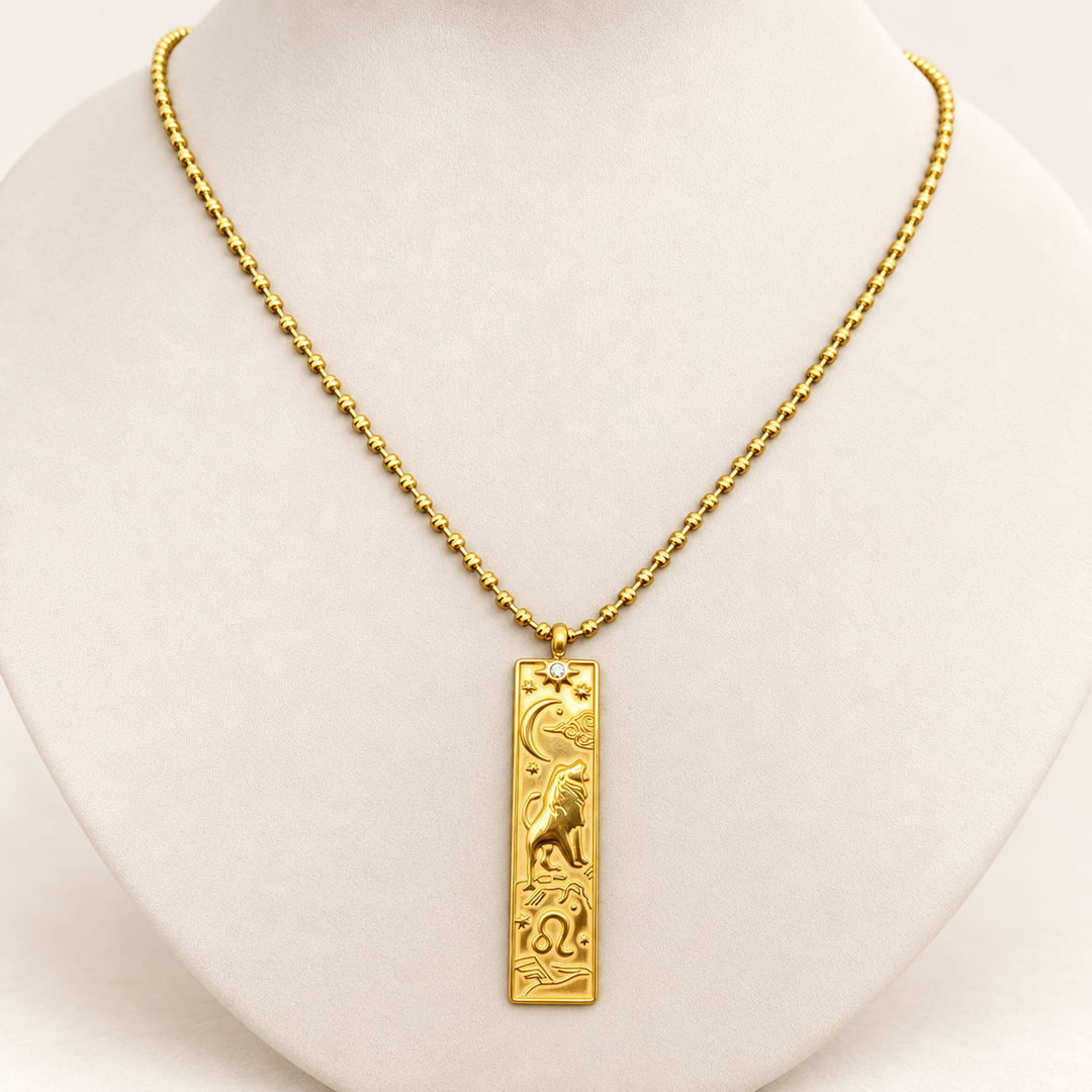 18K gold-plated Zodiac necklace, Leo, on a light-coloured jewellery bust.