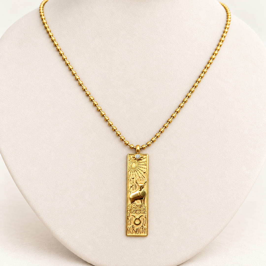 18K gold-plated Zodiac necklace, Taurus, on a light-coloured jewellery bust.
